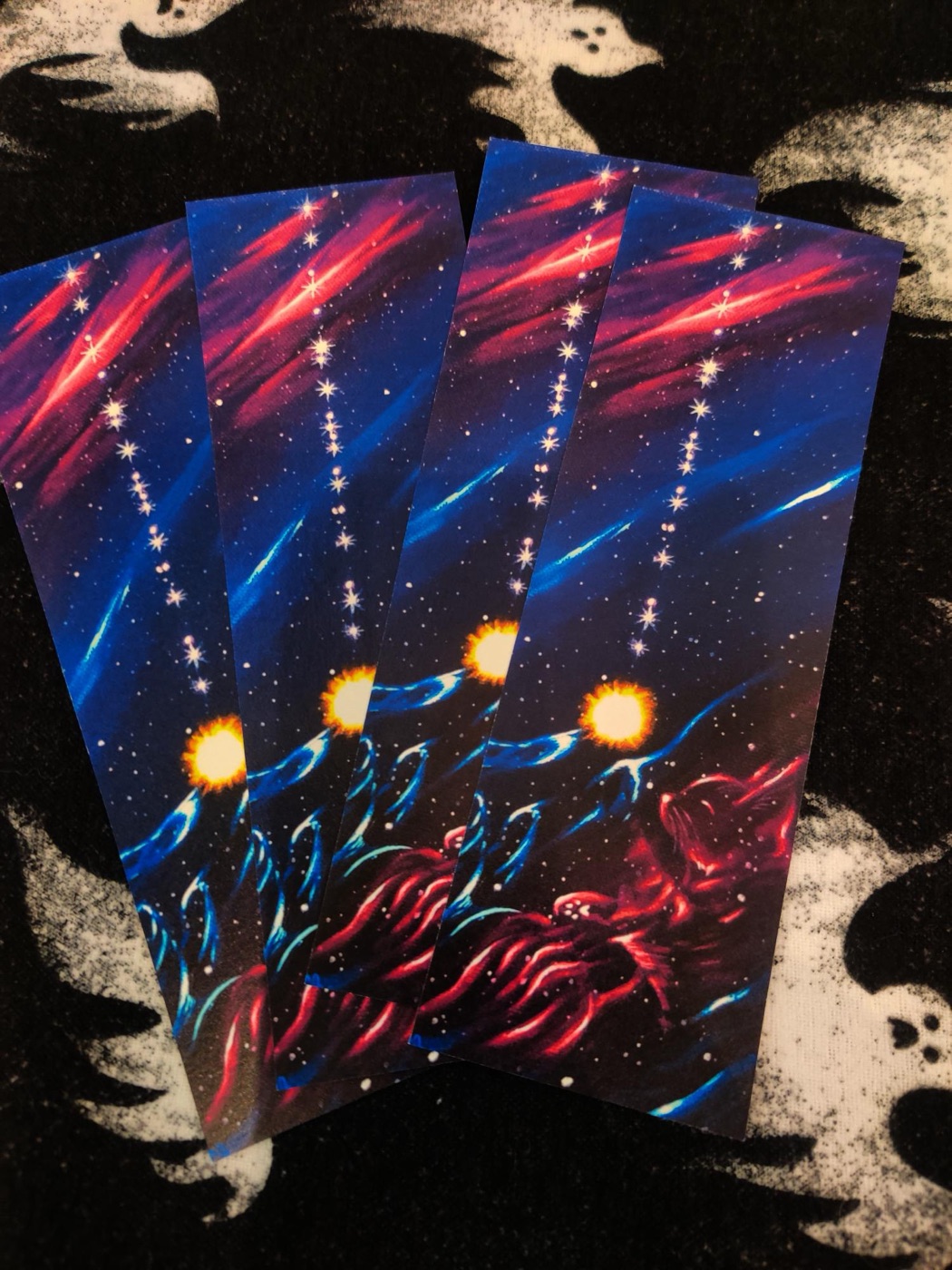 Set of red and blue space-themed rectangular prints with glowing orange moons
